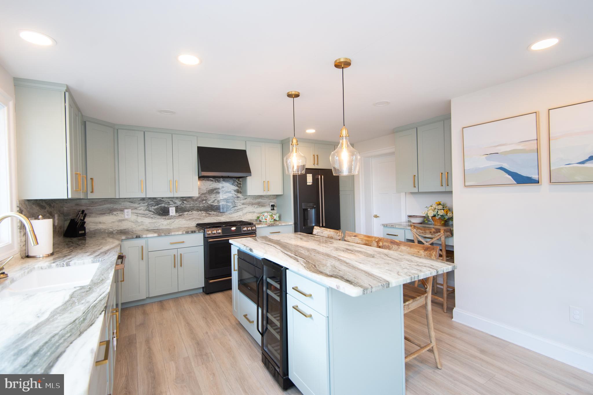 110 Second Street Secretary, MD 21664 - Photo 5 of 36 a kitchen with a stove a sink a refrigerator and a microwave