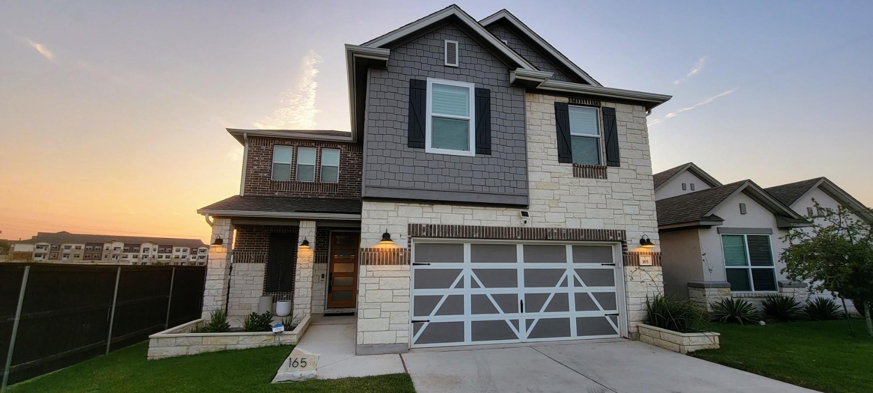 a front view of a house with garden