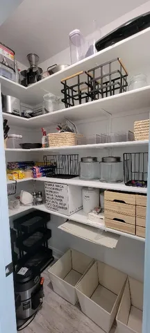 a kitchen with a stove and a shelf