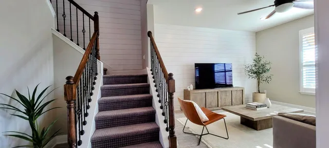 a livingroom with furniture window and wooden floor
