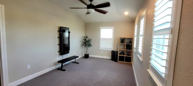 a view of a livingroom with furniture and a window