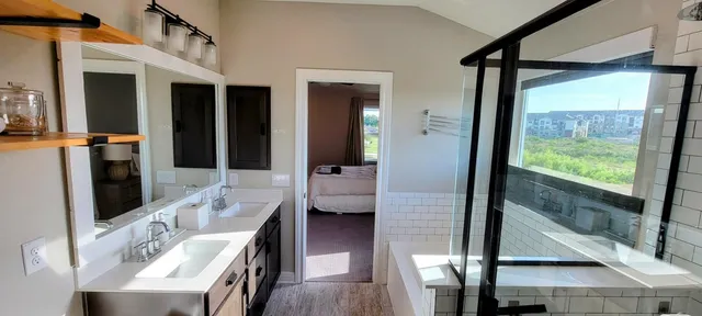 a dining room with furniture and a window