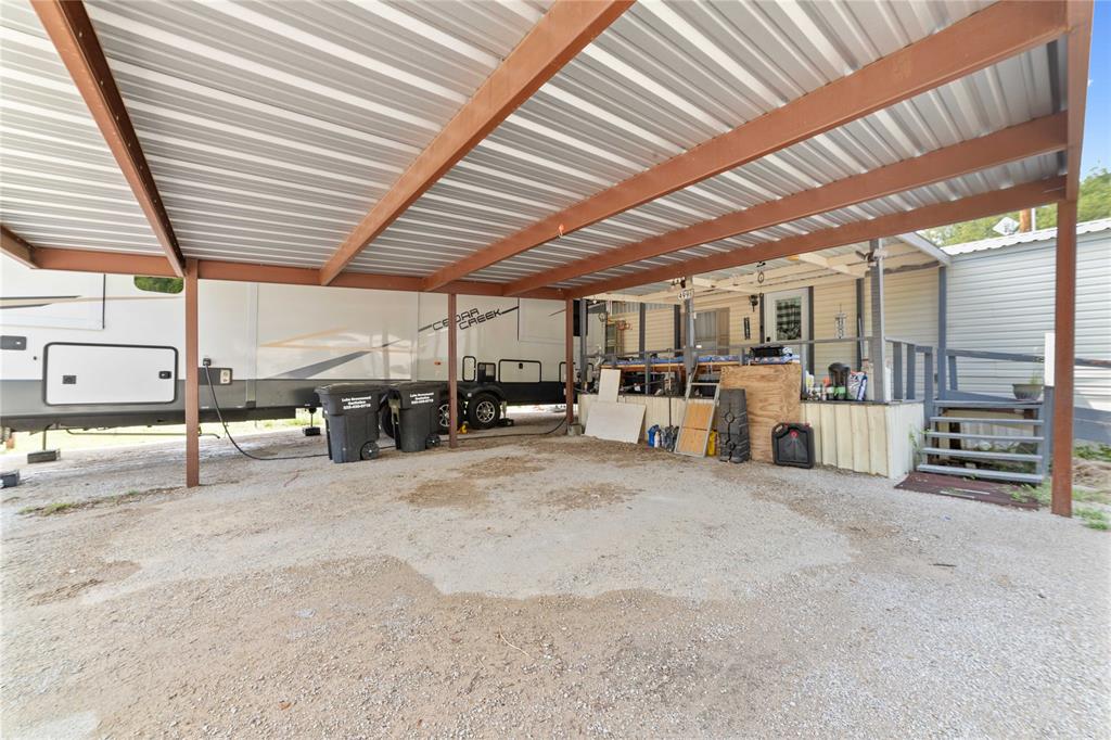 4991 Thunderbird Drive May, TX 76857 - Photo 24 of 34 View of patio / terrace with a carport