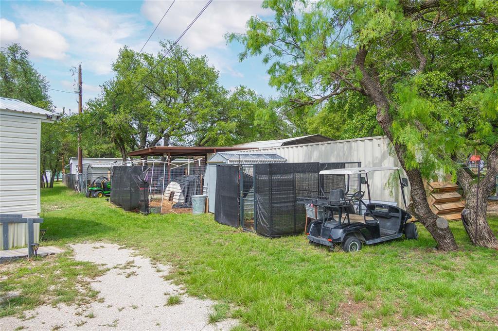 4991 Thunderbird Drive May, TX 76857 - Photo 26 of 34 View of yard featuring an outbuilding