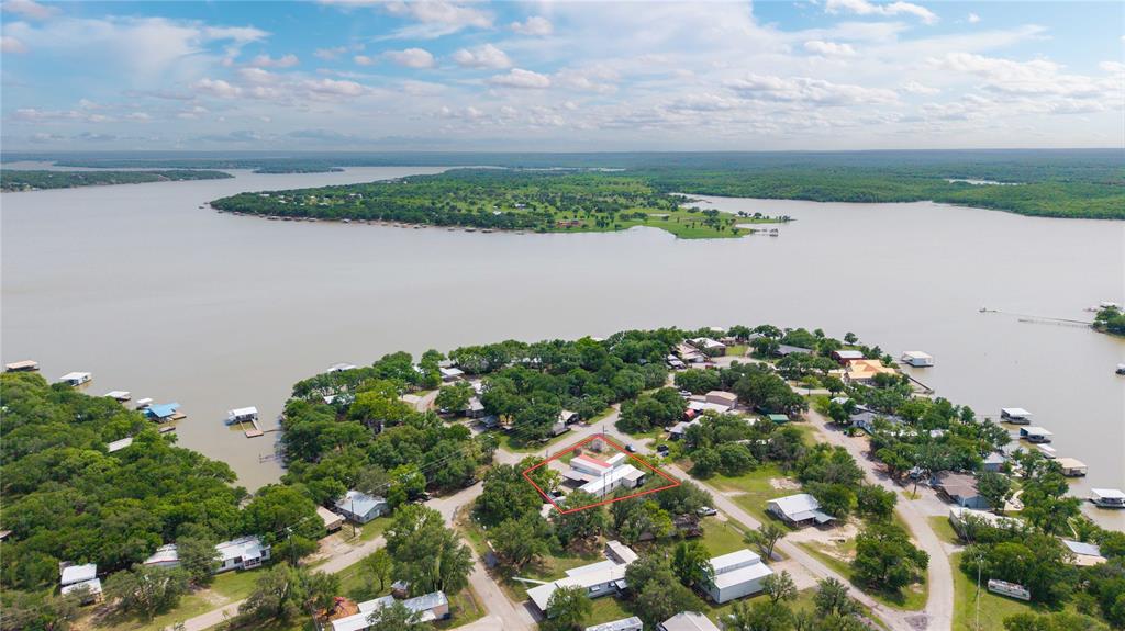 4991 Thunderbird Drive May, TX 76857 - Photo 8 of 34 Aerial view featuring a wooded view and a water view