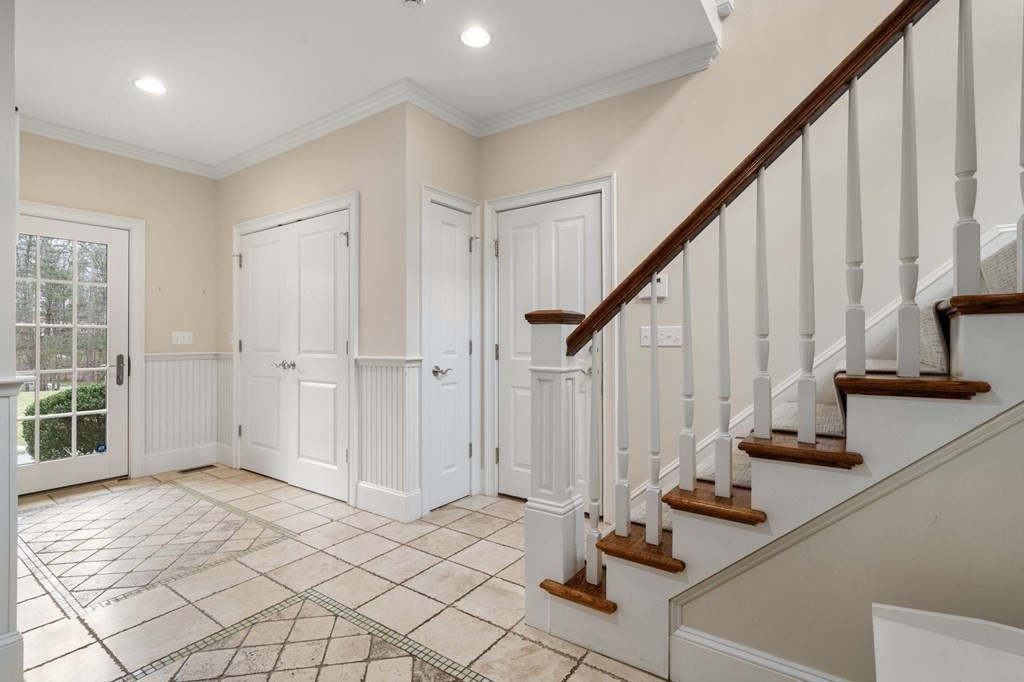 7 Donnelly Drive Dover, MA 02030 - Photo 16 of 29 a view of an entryway with wooden floor and staircase