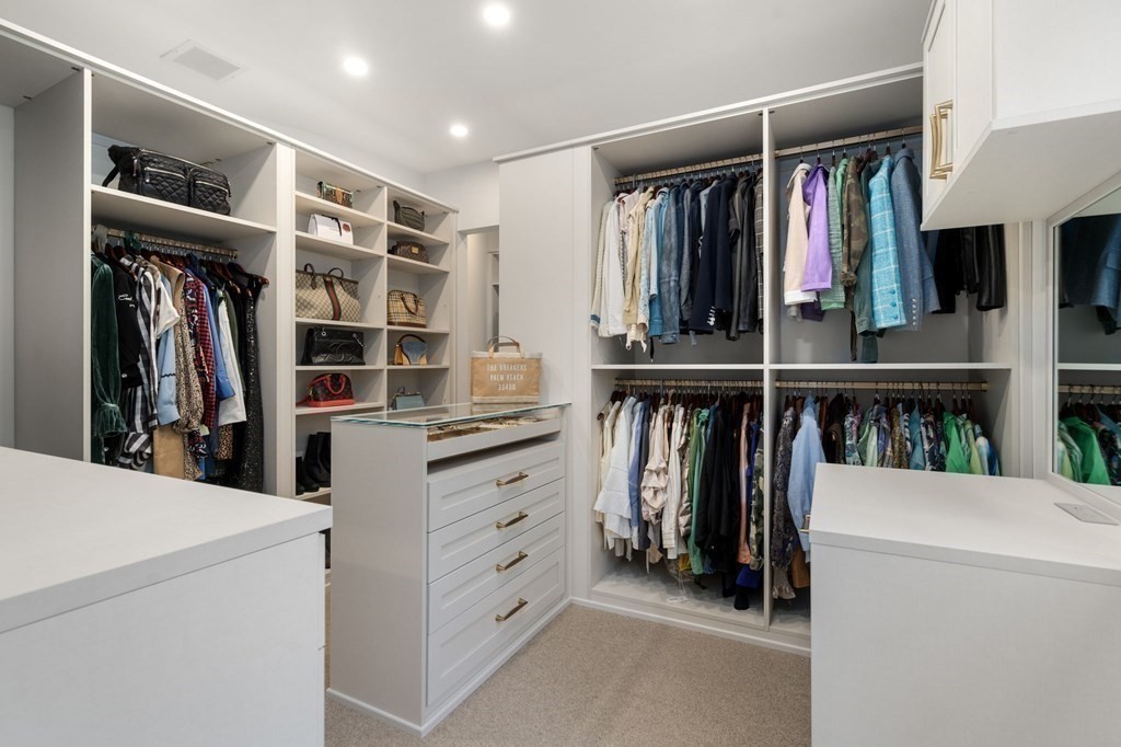 7 Donnelly Drive Dover, MA 02030 - Photo 18 of 29 a view of walk in closet with clothes and shoes