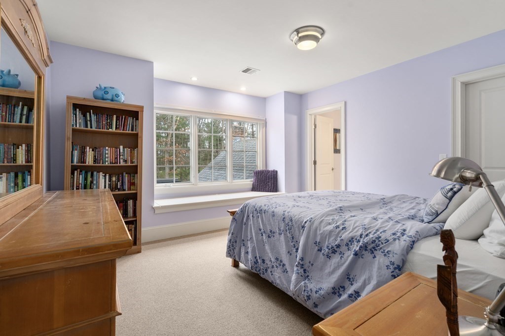 7 Donnelly Drive Dover, MA 02030 - Photo 20 of 29 a bedroom with a bed and a large window with the outer view