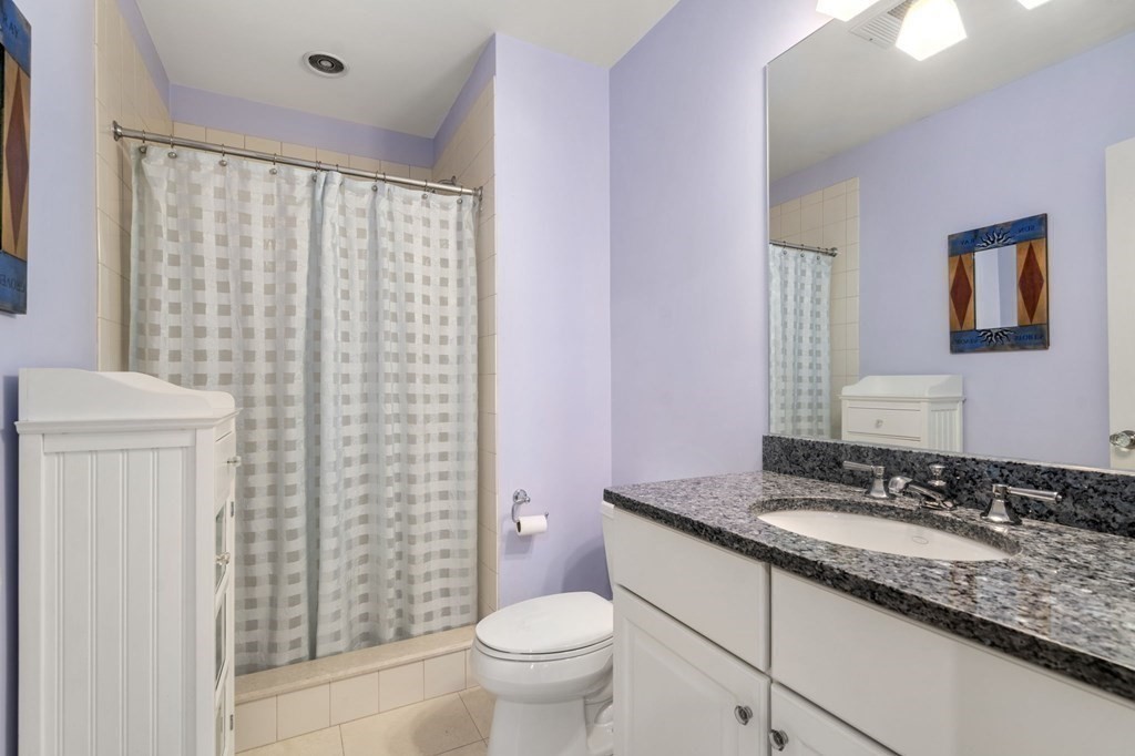 7 Donnelly Drive Dover, MA 02030 - Photo 21 of 29 a bathroom with a granite countertop sink toilet and a mirror