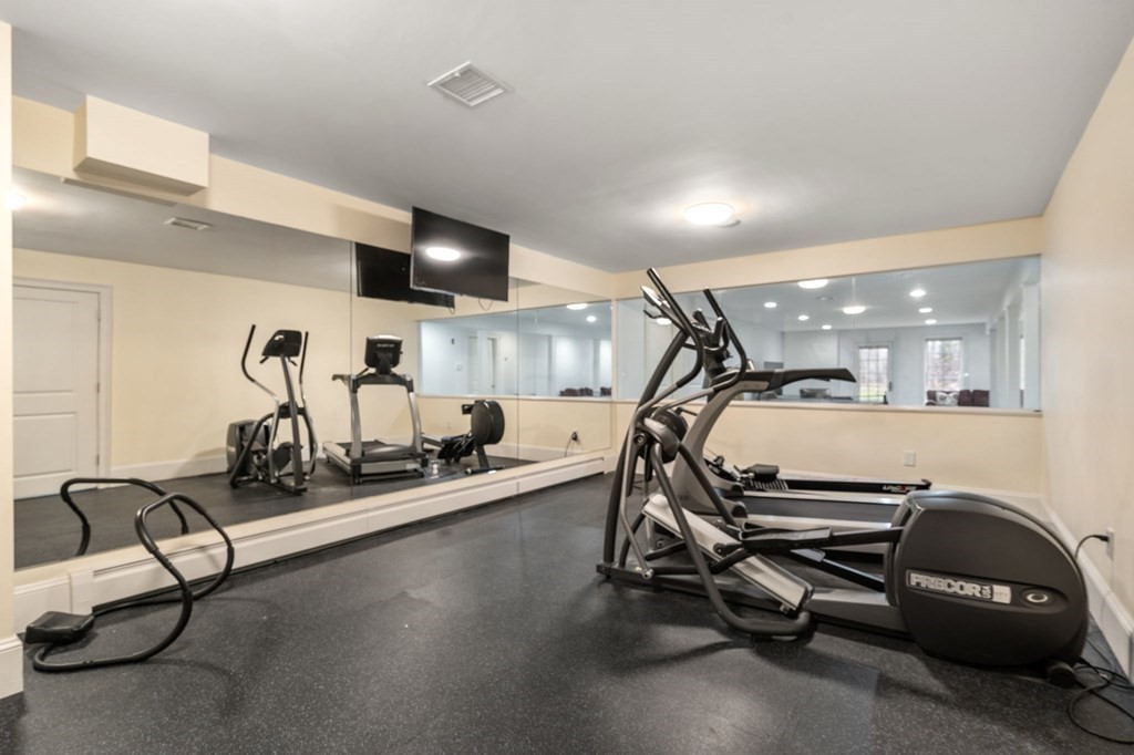 7 Donnelly Drive Dover, MA 02030 - Photo 24 of 29 a view of a room with gym equipment