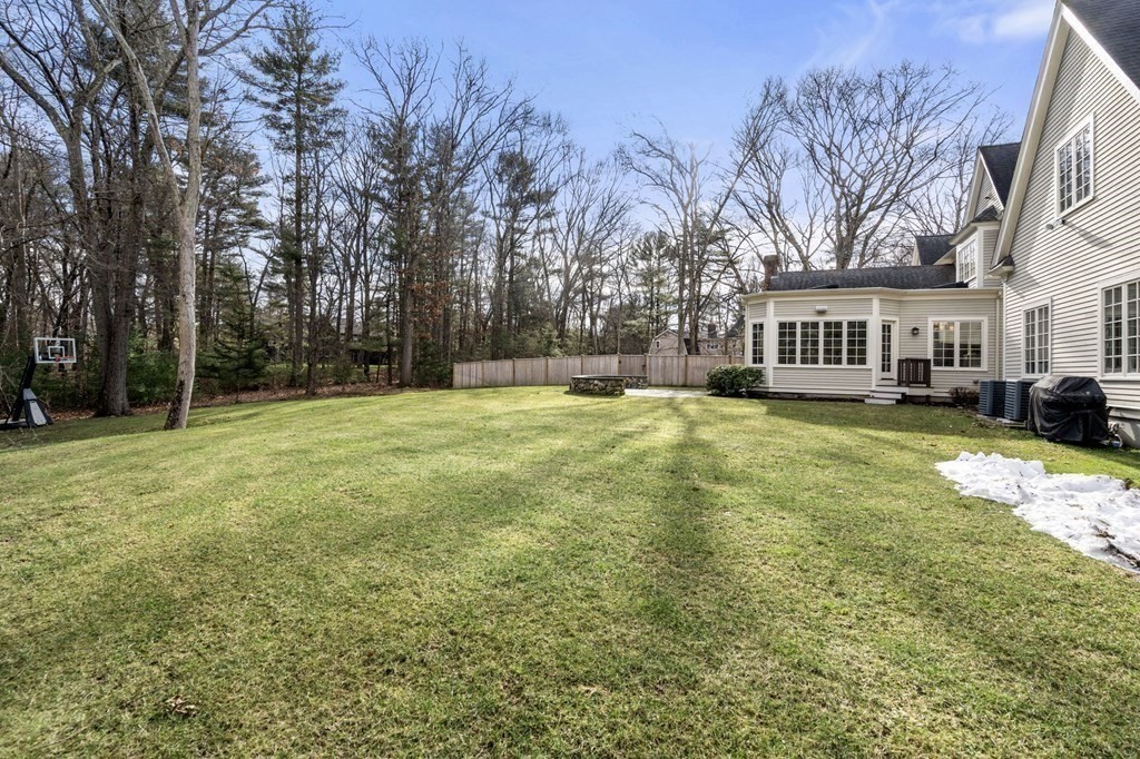 7 Donnelly Drive Dover, MA 02030 - Photo 26 of 29 a view of a yard with a house in the background