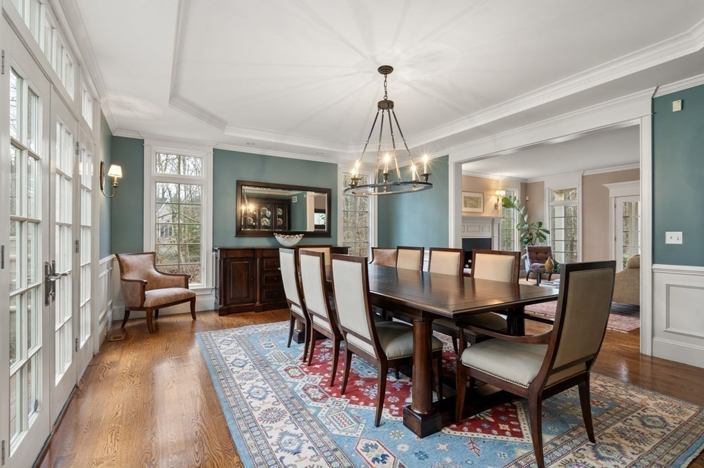 7 Donnelly Drive Dover, MA 02030 - Photo 4 of 29 a view of a dining room with furniture a chandelier and wooden floor