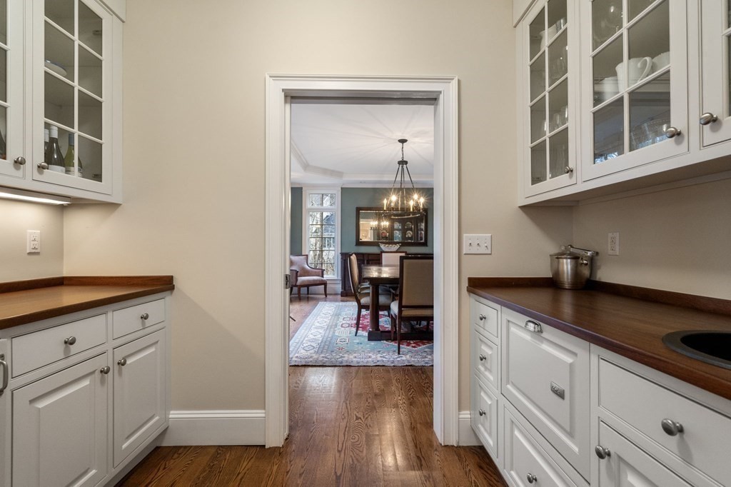 7 Donnelly Drive Dover, MA 02030 - Photo 6 of 29 a kitchen with cabinets and wooden floor