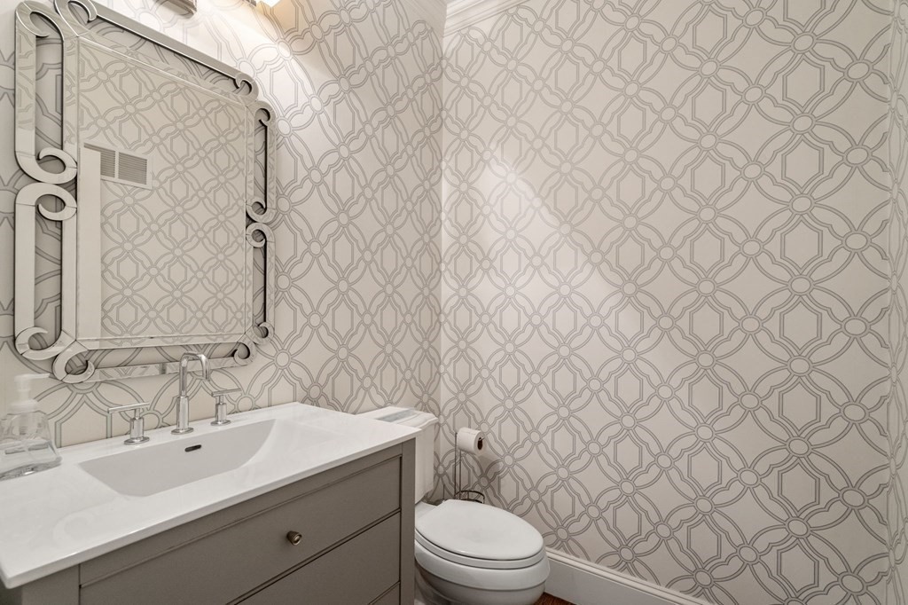 7 Donnelly Drive Dover, MA 02030 - Photo 7 of 29 a bathroom with a toilet a sink and mirror