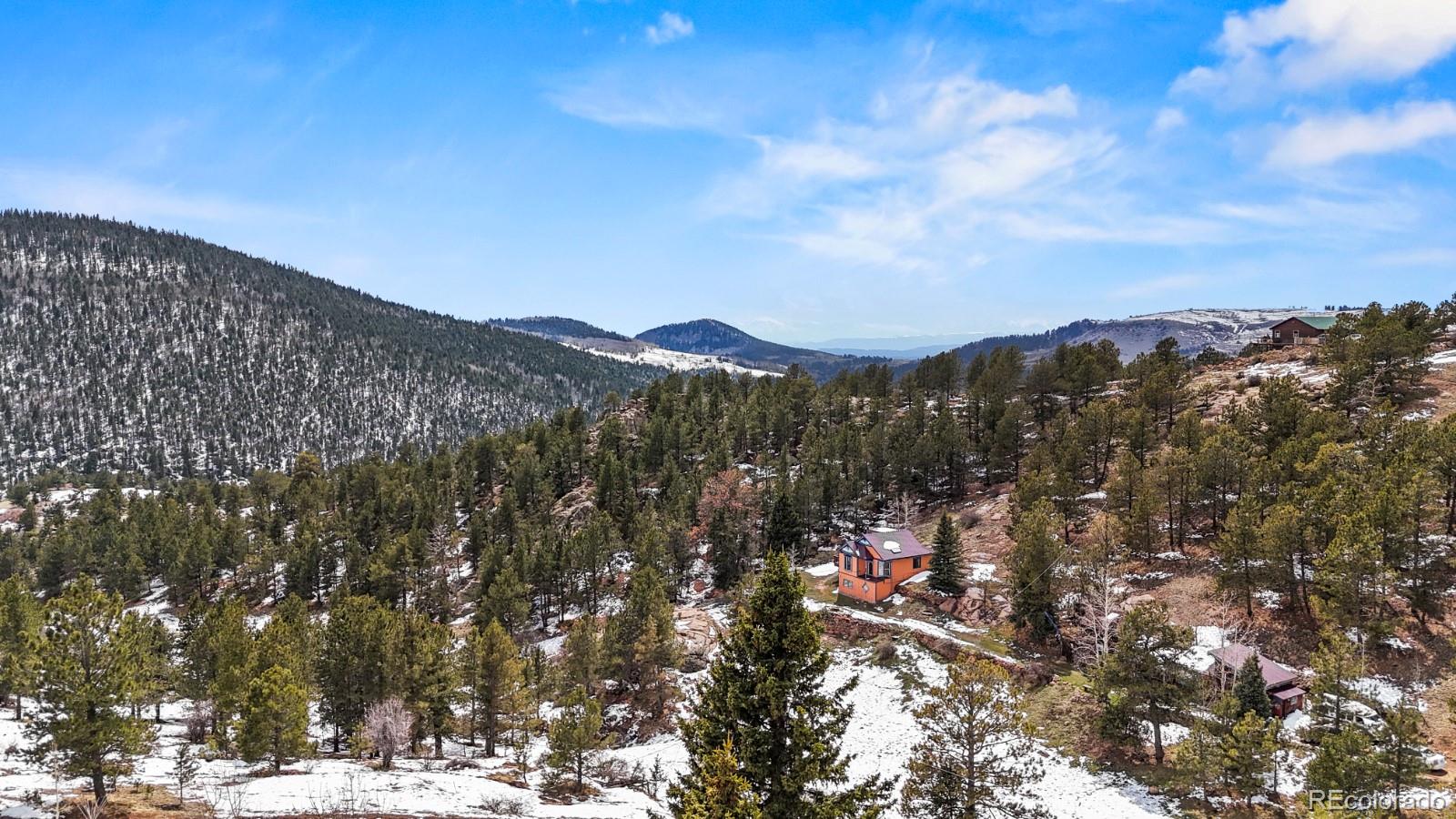 315 5th Street Victor, CO 80860 - Photo 15 of 16 a view of a city with mountains in the background