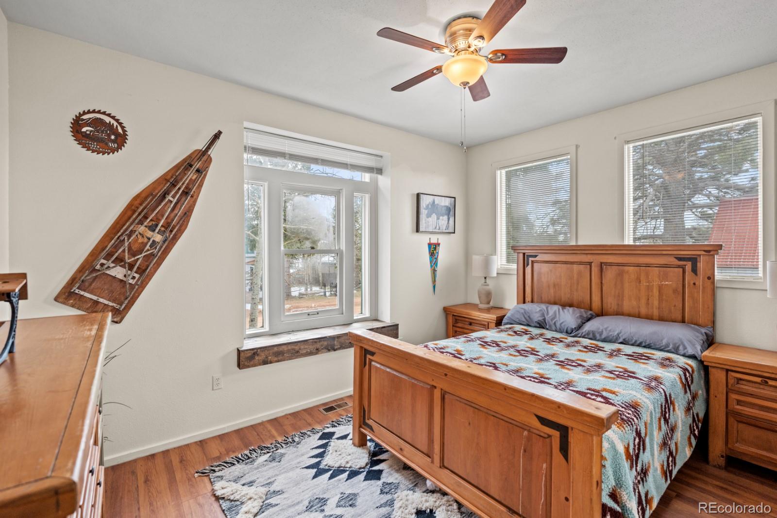 315 5th Street Victor, CO 80860 - Photo 8 of 16 a bedroom with a bed and a window