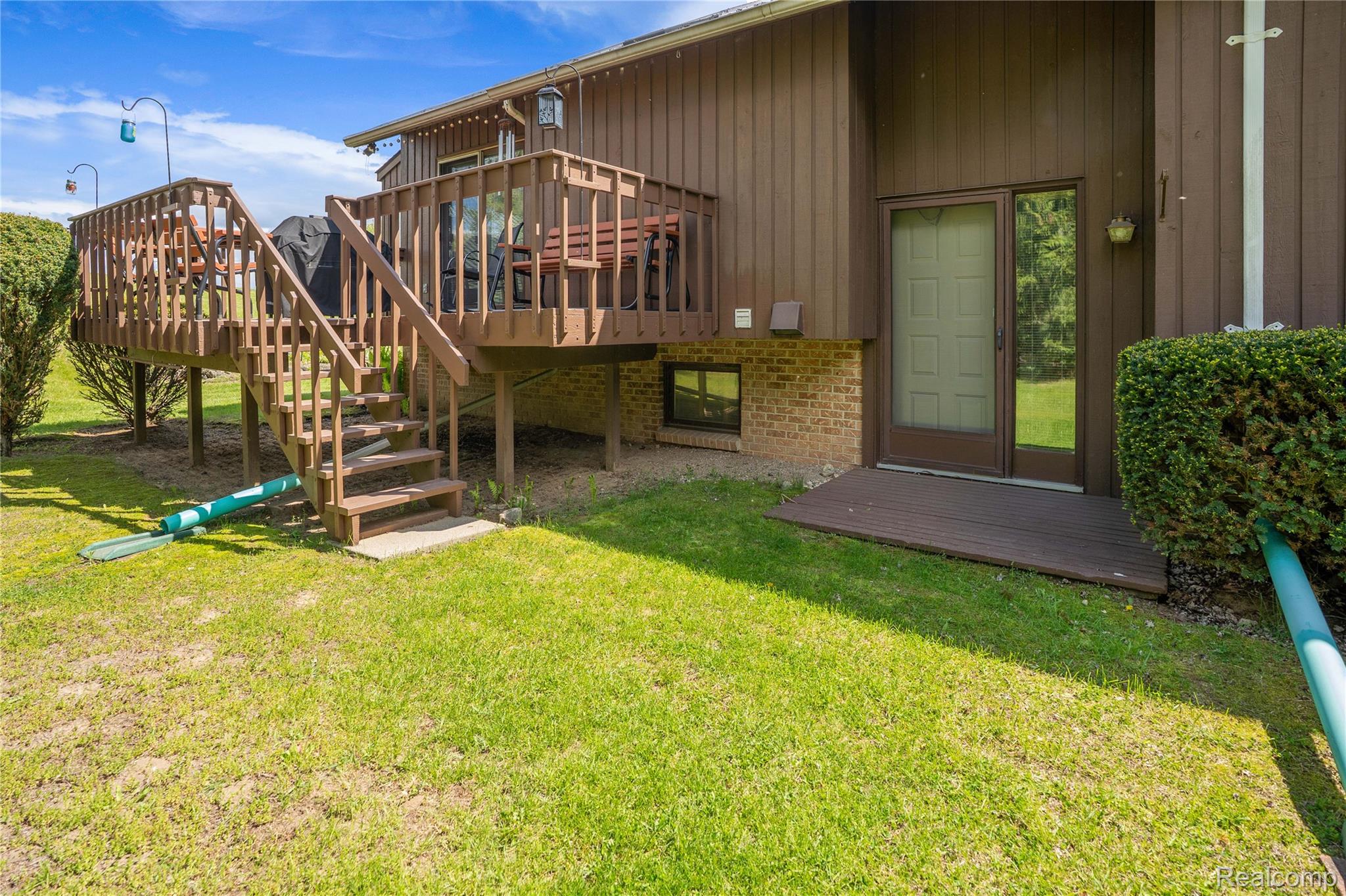 2725 Cooley Lake Road Highland, MI 48356 - Photo 55 of 67 View of house and deck