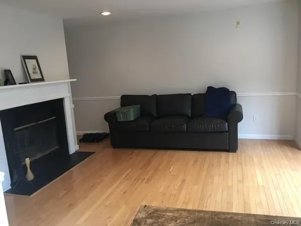 a living room with a couch and a fireplace