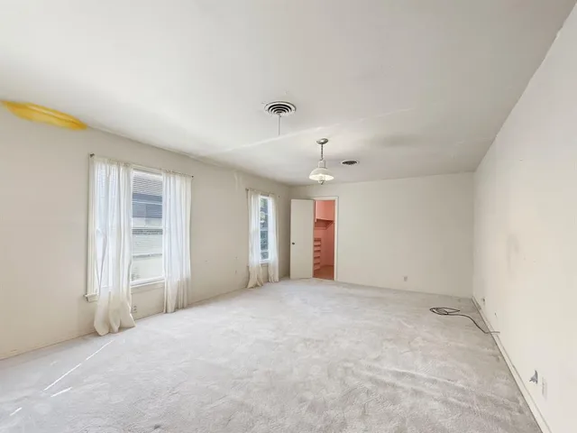 an empty room with windows