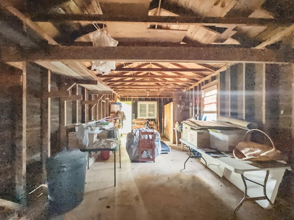 817 South Rusk Street Gainesville, TX 76240 - Photo 21 of 25 a living room with furniture and a chandelier