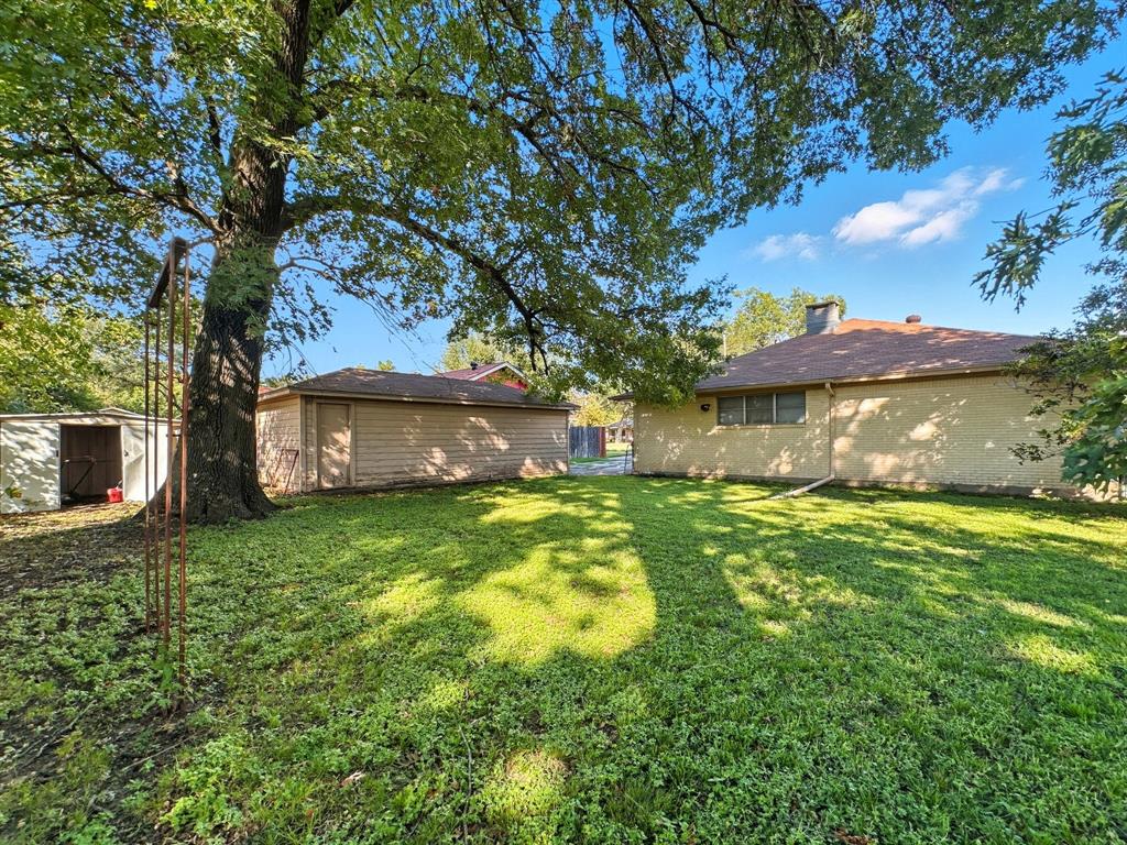 817 South Rusk Street Gainesville, TX 76240 - Photo 25 of 25 a view of a house with a yard