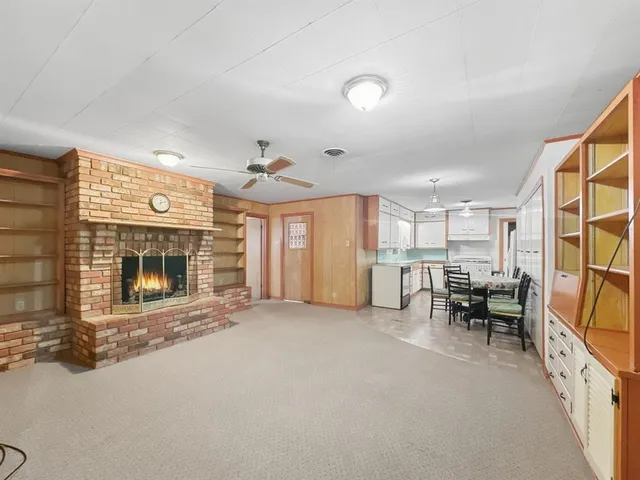 a view of a livingroom with furniture and a fireplace