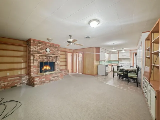 a view of livingroom with furniture and a fireplace
