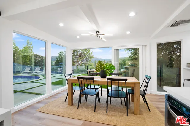 a bathroom with a sink and a large mirror