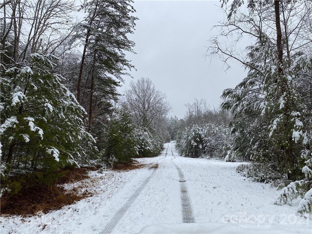 159 Pilot Ridge Road, Unit 25 Nebo, NC 28761 - Photo 30 of 32 a view of a road with a snow in the background