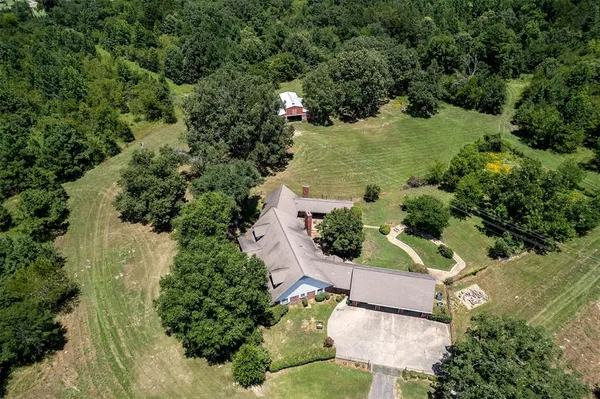 an aerial view of residential house with outdoor space