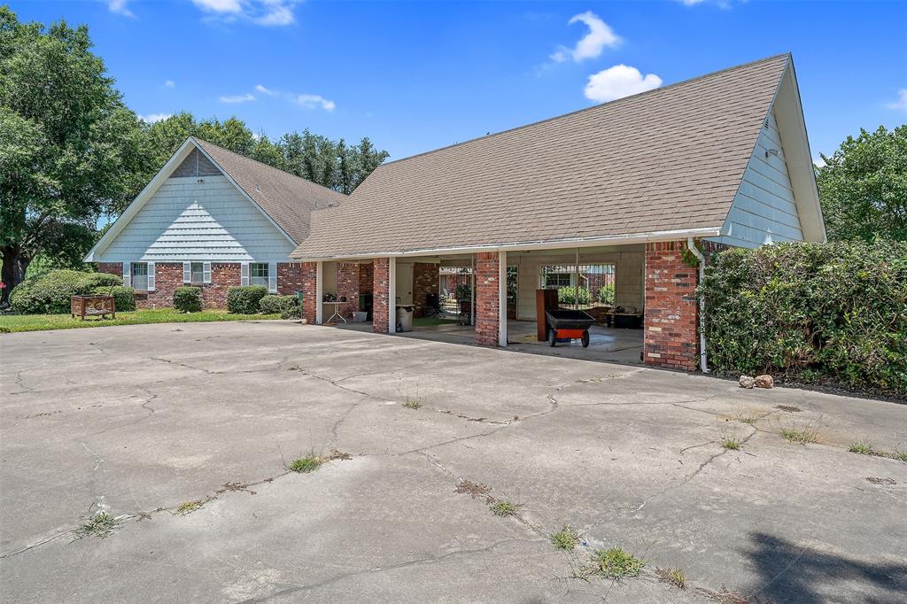 100 Inwood Street Mineola, TX 75773 - Photo 13 of 31 a house view with a garden space