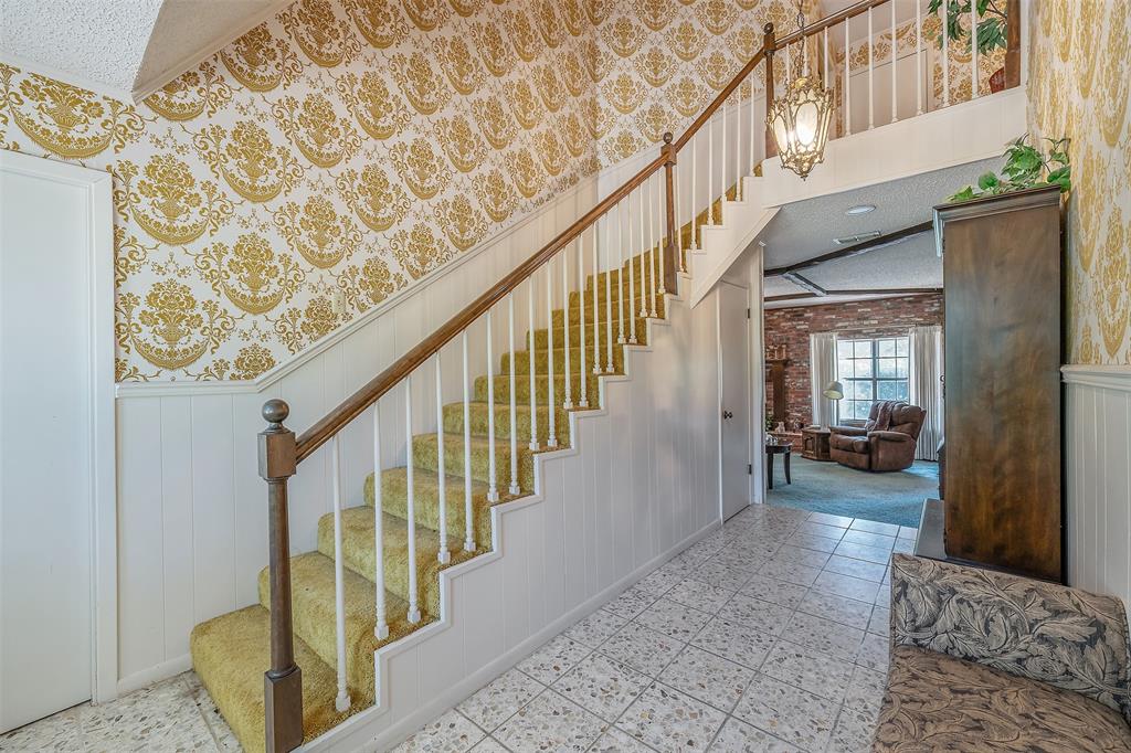 100 Inwood Street Mineola, TX 75773 - Photo 15 of 31 a view of staircase with wooden floor and a rug