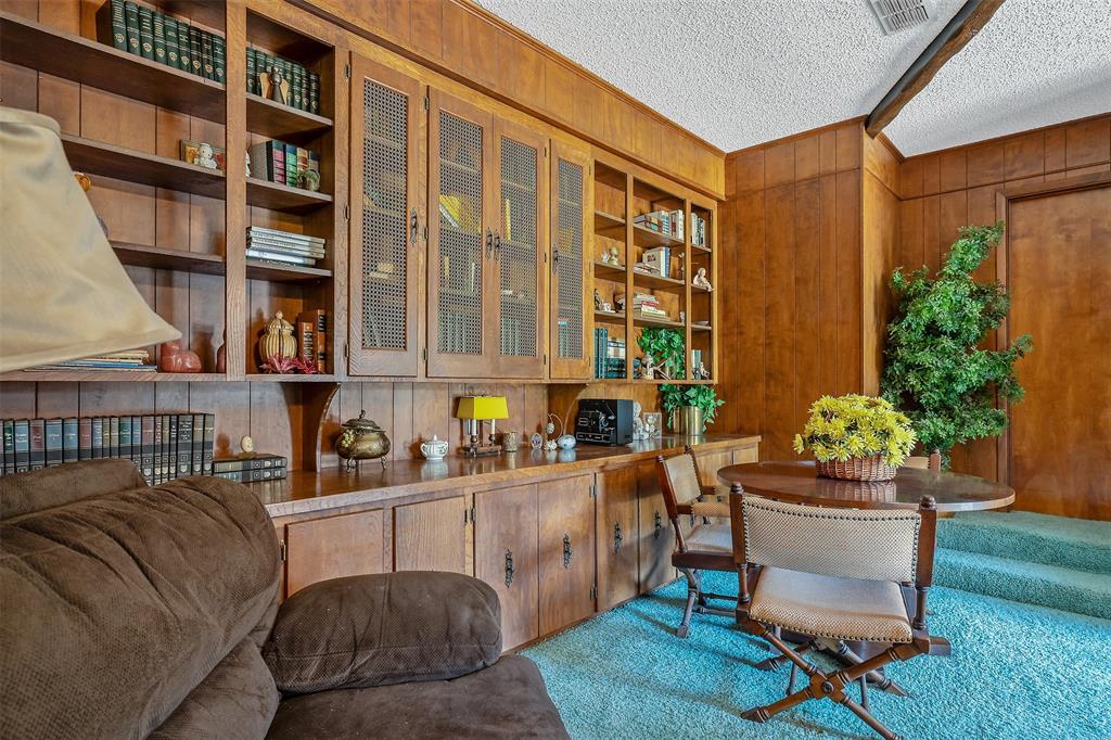 100 Inwood Street Mineola, TX 75773 - Photo 17 of 31 a living room with furniture and a potted plant