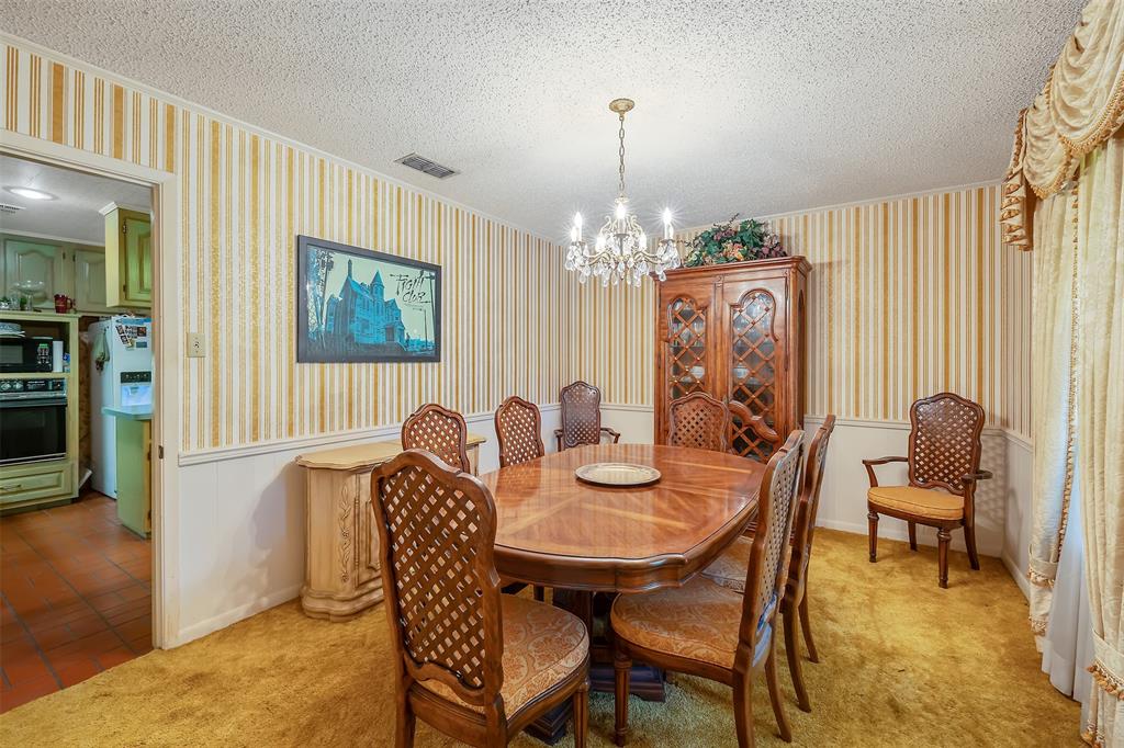 100 Inwood Street Mineola, TX 75773 - Photo 20 of 31 a view of a dining room with furniture and chandelier