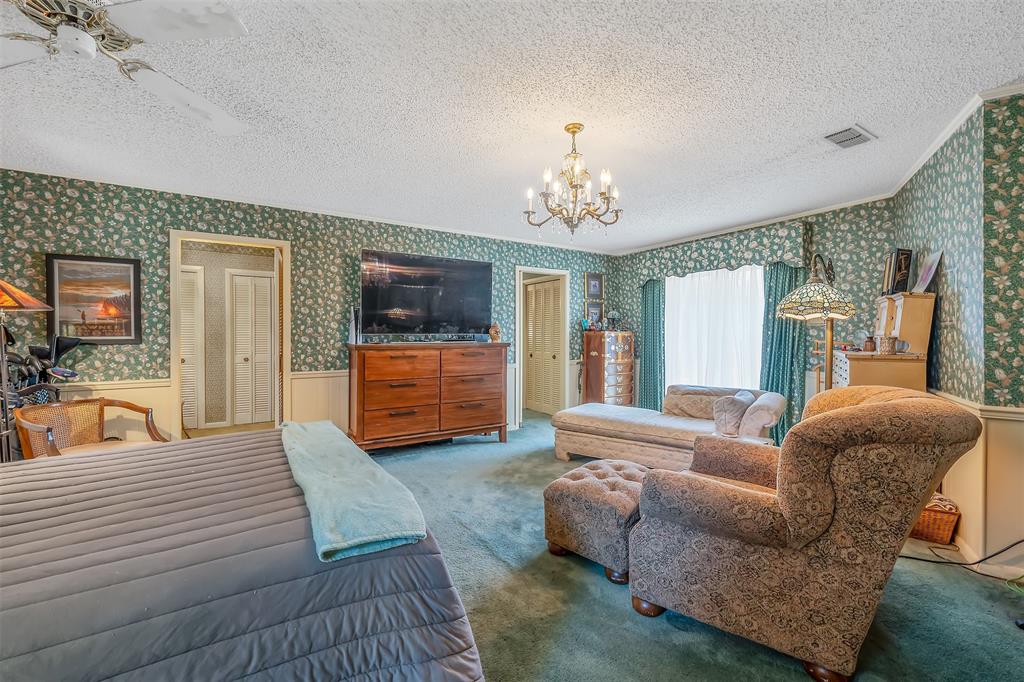 100 Inwood Street Mineola, TX 75773 - Photo 21 of 31 a living room with furniture and a flat screen tv
