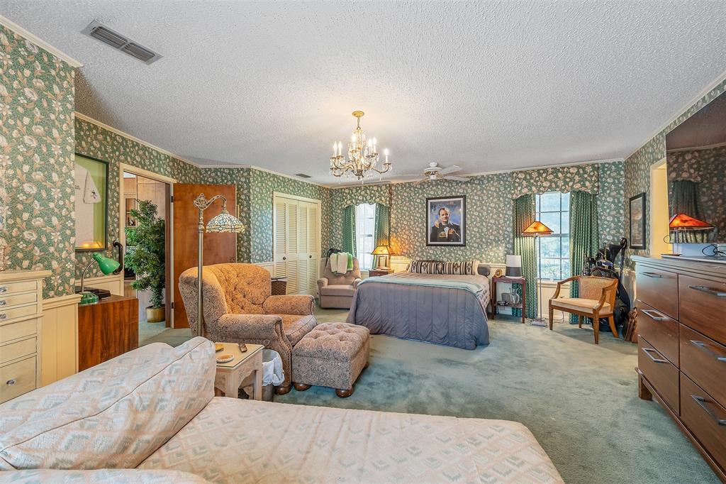 100 Inwood Street Mineola, TX 75773 - Photo 22 of 31 a living room with furniture and a chandelier