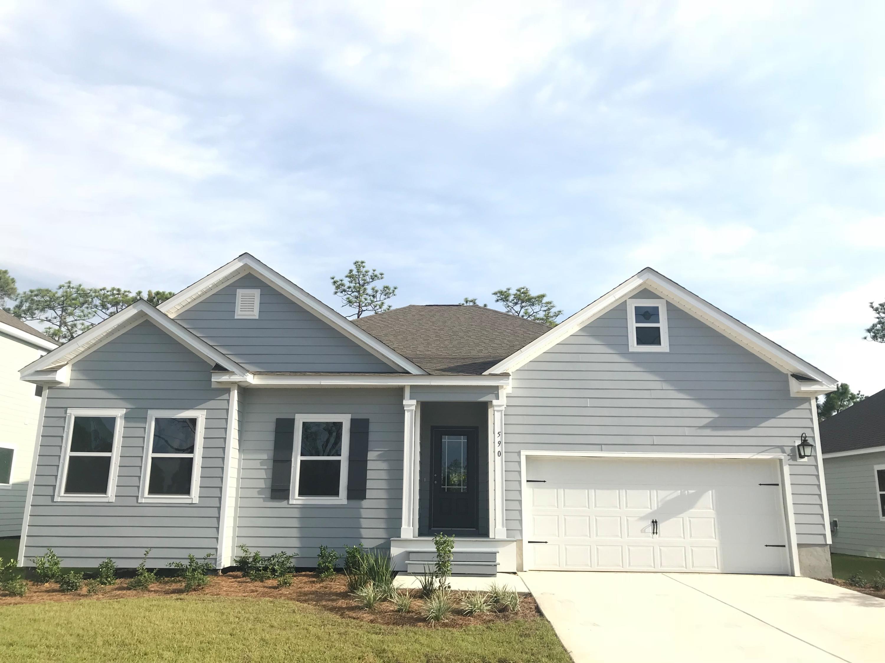 590 Las Roblas Grande Drive Santa Rosa Beach, FL 32459 - Photo 2 of 20 a front view of a house with a yard