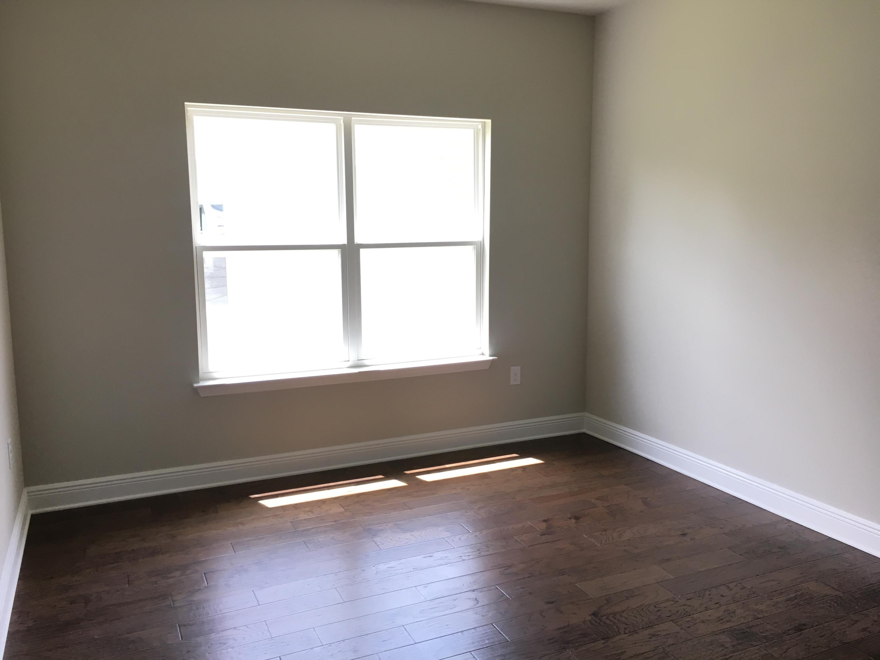 590 Las Roblas Grande Drive Santa Rosa Beach, FL 32459 - Photo 11 of 20 an empty room with wooden floor and windows