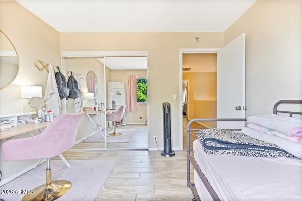 a view of a room with wooden floor