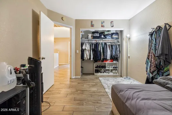 a bedroom with bed and a window