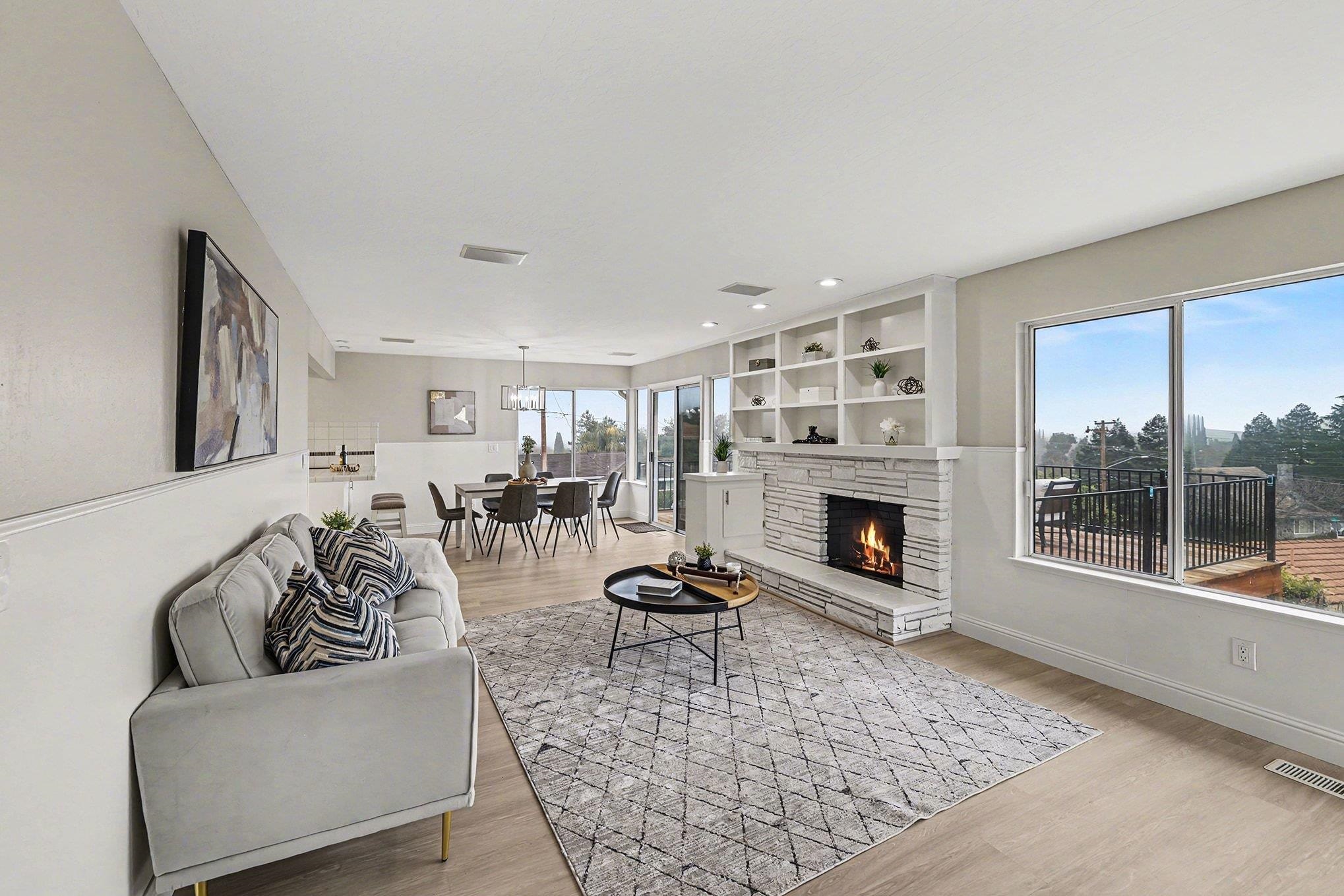 6 Lake Street Pittsburg, CA 94565 - Photo 11 of 29 a living room with furniture a fireplace and a large window
