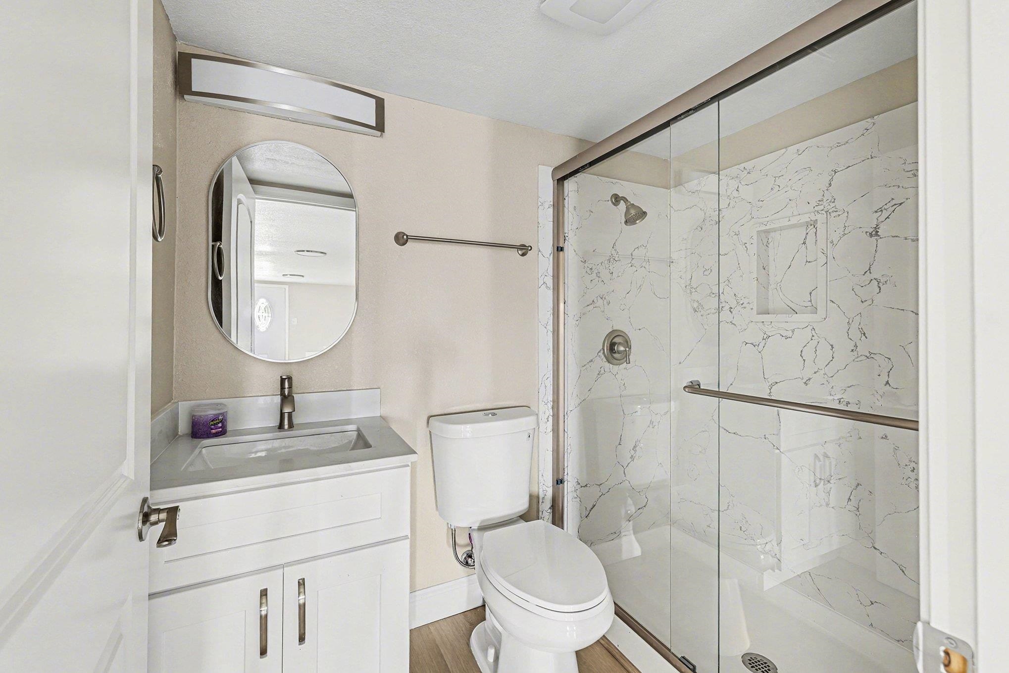 6 Lake Street Pittsburg, CA 94565 - Photo 16 of 29 a bathroom with a toilet sink vanity granite and shower