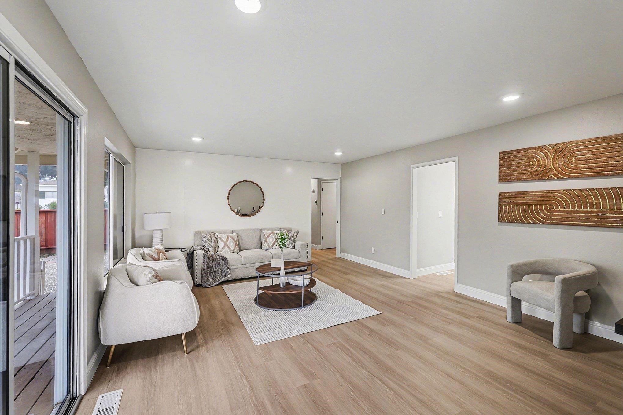 6 Lake Street Pittsburg, CA 94565 - Photo 7 of 29 a living room with furniture and a wooden floor