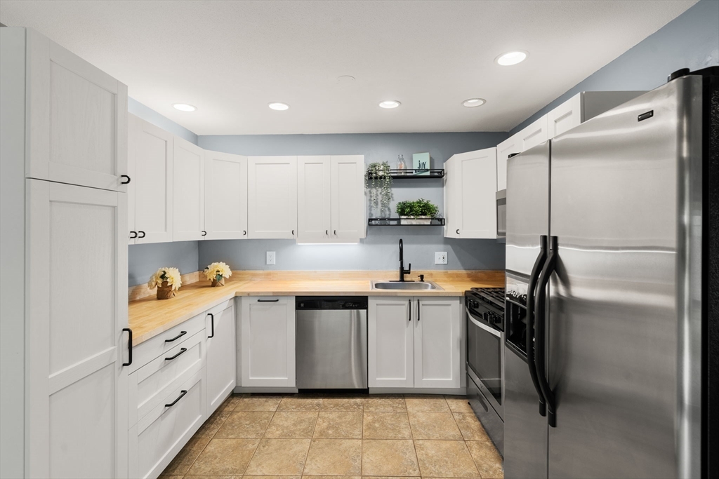 509 Dongary Road, Unit 509 Easton, MA 02375 - Photo 11 of 29 a kitchen with a sink stainless steel appliances and cabinets