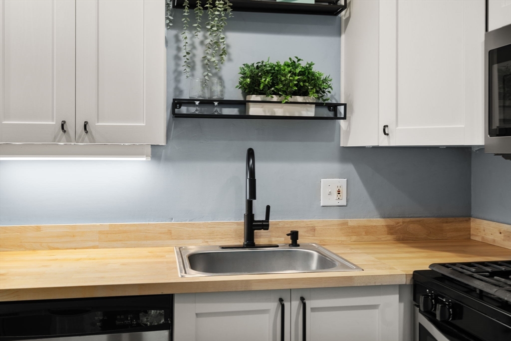 509 Dongary Road, Unit 509 Easton, MA 02375 - Photo 12 of 29 a kitchen with a sink and cabinets