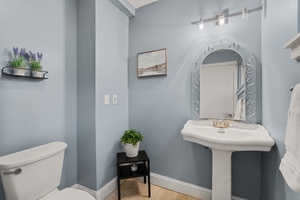 509 Dongary Road, Unit 509 Easton, MA 02375 - Photo 15 of 29 a bathroom with a toilet sink and mirror