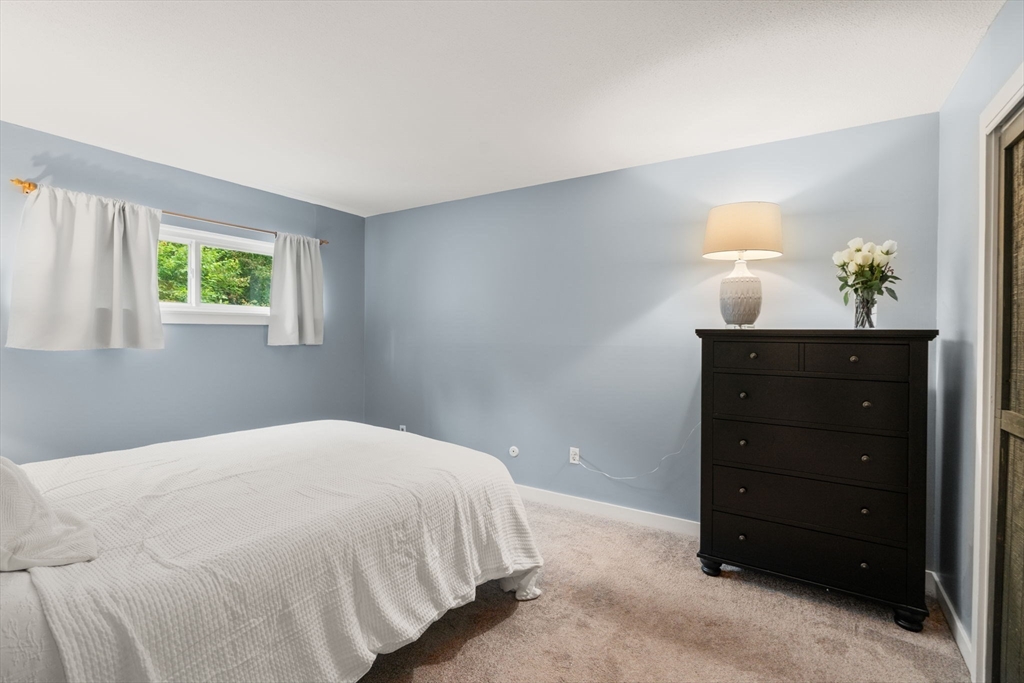 509 Dongary Road, Unit 509 Easton, MA 02375 - Photo 18 of 29 a bedroom with a bed and a dresser