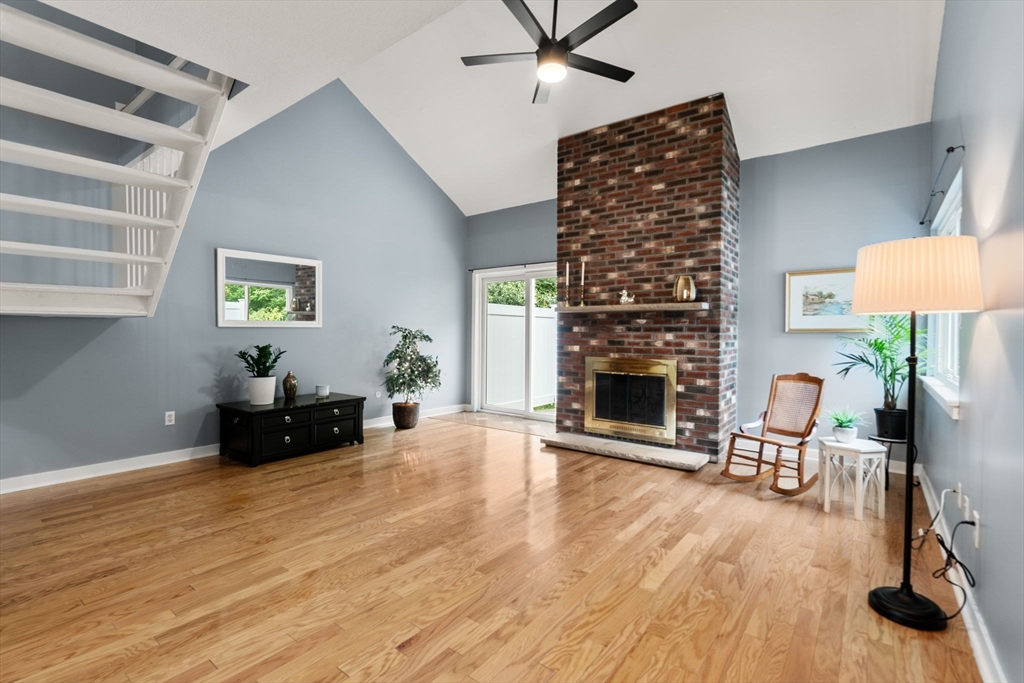 509 Dongary Road, Unit 509 Easton, MA 02375 - Photo 8 of 29 a living room with furniture and a fireplace