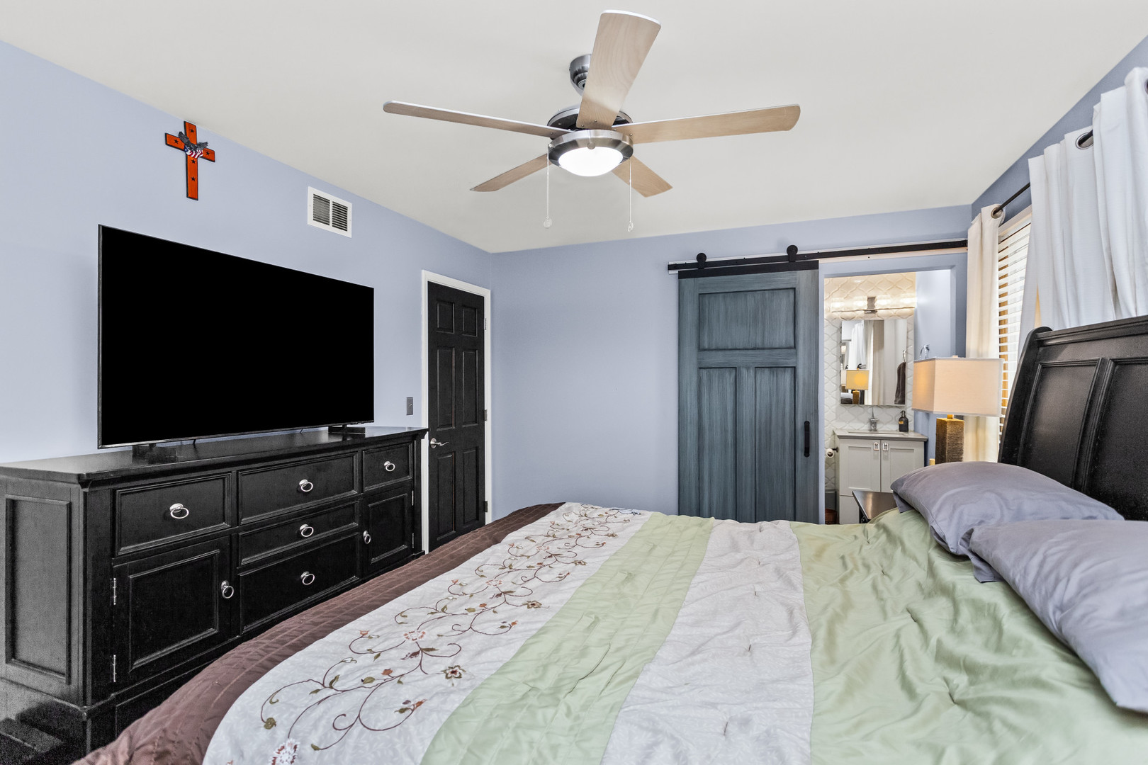 960 Mensching Road Roselle, IL 60172 - Photo 15 of 25 a bedroom with a bed and a flat screen tv