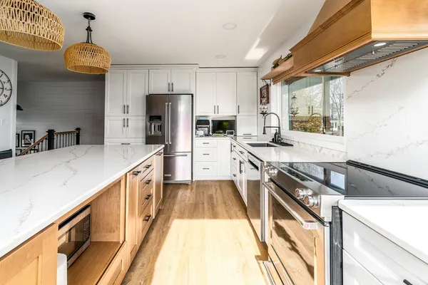 a kitchen with a stove a sink and a refrigerator